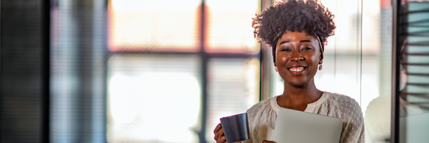 Woman smiling with coffee Woman smiling with coffee