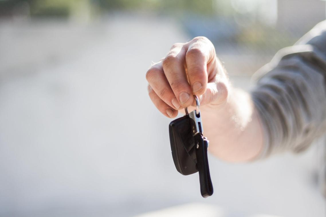 Man holding car keys Man holding car keys