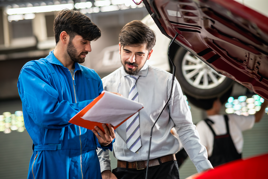 Garage man work explain to his boss